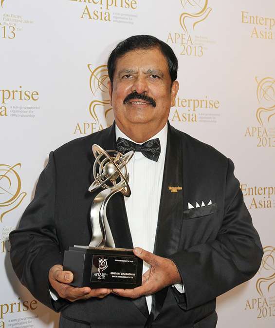 Graetian Gunawardhana holding an award.jpg